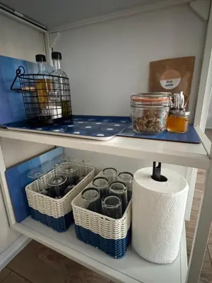 a shelf with baskets and a roll of toilet paper at ap Knyaz Boris I in Varna City