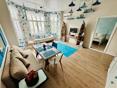 a living room with a couch and a table at ap Knyaz Boris I in Varna City