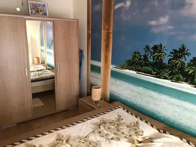 a bedroom with a view of the ocean at Terasa Ravda apart in Ravda