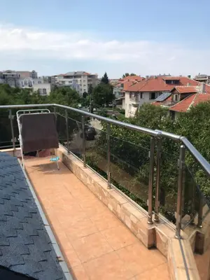 a balcony with a view of a city at Terasa Ravda apart in Ravda