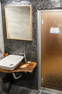 a bathroom with a sink and a shower at Afala Loft & Terrase - Heart of Burgas in Burgas City