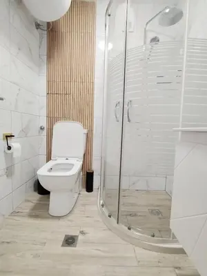 a bathroom with a toilet and a shower at Sea Breeze in Burgas City