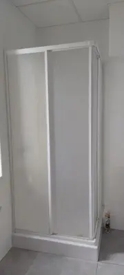 a sliding glass door in a white room at Imperial Sea View in Burgas City