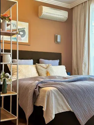 a bedroom with a bed and a book shelf at Emerald Breeze Studio in Hotel SPA Resort Emerald in Ravda