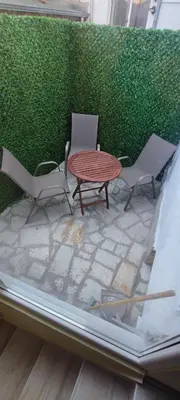 a table and two chairs and a table and chairs at KOKO House in Varna City