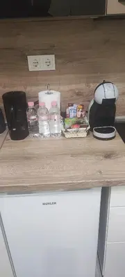 a counter top with food and water bottles on it at KOKO House in Varna City