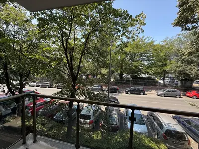 a balcony with a view of a parking lot at Beach Please Apartment in Burgas City