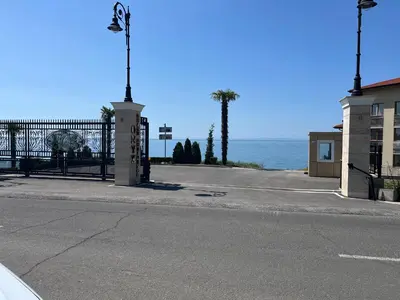 an empty street with the ocean in the background at Onyx Sveti Vlas частни апартаменти in Sveti Vlas