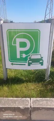 a sign for a parking lot with a car on it at Sunrise Apartment 14 in Obzor