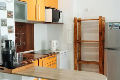 a kitchen with a counter top and a refrigerator at Mirage Collective in Nesebar