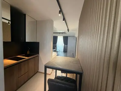 a kitchen with a table and a counter top at Studio Port Nessebar in Nesebar
