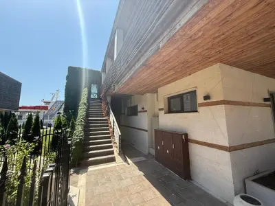 a house with a staircase leading up to a building at Studio Port Nessebar in Nesebar