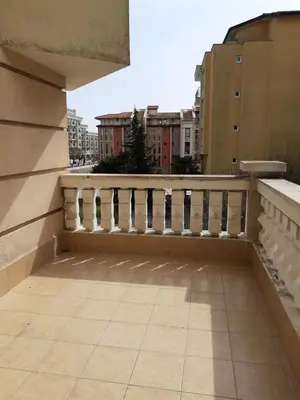a balcony with a white railing on a building at Сънсет резорт Поморие in Pomorie