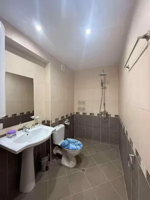 a bathroom with a sink and a toilet and a mirror at Panorama Vigo Studio in Nesebar