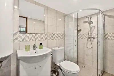 a bathroom with a toilet and a sink and a shower at Augusta's Authentic Farm House in Pchelnik