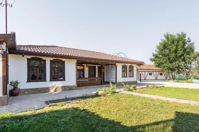 a house with a lawn in front of it at Augusta's Authentic Farm House in Pchelnik