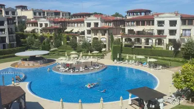 a large swimming pool with people in a resort at Green Life Sozopol 80m2 in Sozopol