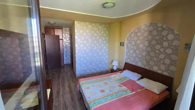 a small bedroom with a bed in a room at Green Life Sozopol 80m2 in Sozopol