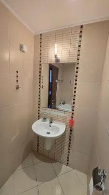a bathroom with a sink and a mirror at Green Life Sozopol 80m2 in Sozopol