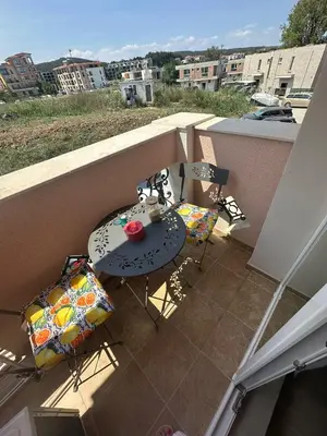 a balcony with a table and chairs on a balcony at Elegant studio - 100 m from Smokinya Beach by Flat Mаnager in Sozopol