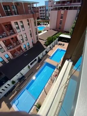 an overhead view of two swimming pools in a building at Sweet Home 9 in Sunny Beach