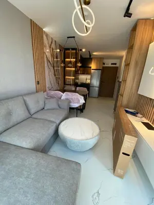 a living room with a couch and a table at Sweet Home 9 in Sunny Beach