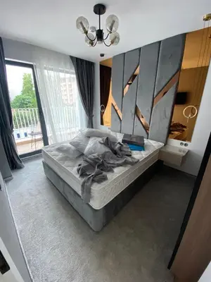 a bedroom with a bed in a room with a window at Sweet Home 9 in Sunny Beach