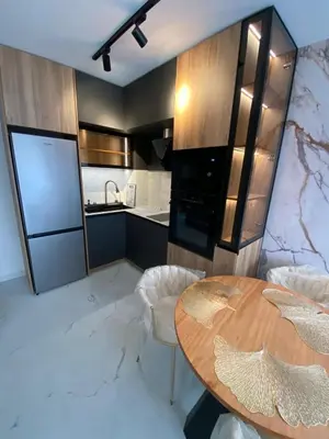 a kitchen with a wooden table and a counter at Sweet Home 9 in Sunny Beach