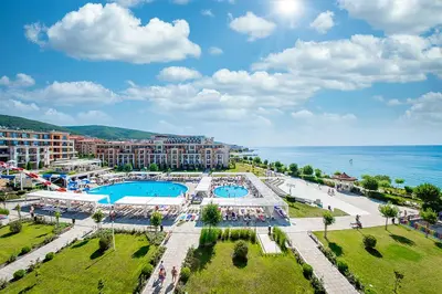 an aerial view of a resort with two pools and the ocean at Premier Fort Beach in Sveti Vlas