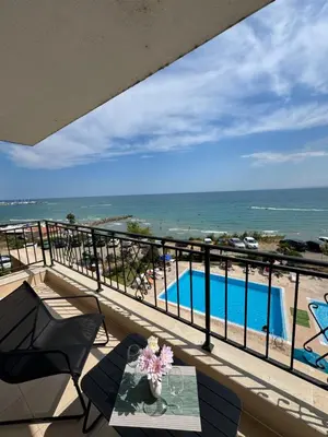 a balcony with a view of the ocean at Ипанемма с 1 спальней корпус А in Sveti Vlas