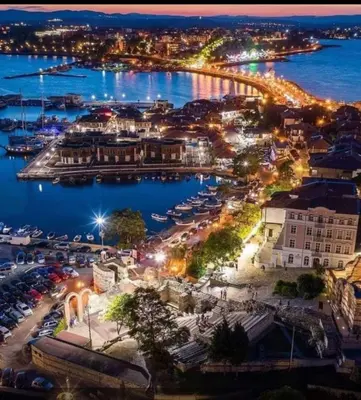 an aerial view of a harbor at night at Rainbow 2 Aparthotel Complex in Sunny Beach