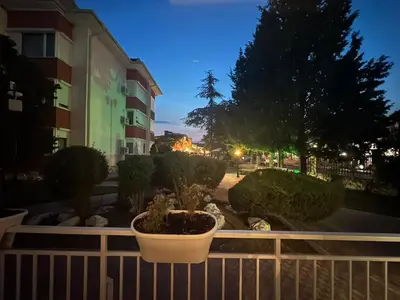 a balcony of a building with a potted plant at Apartment in Sunny Fort in Sunny Beach