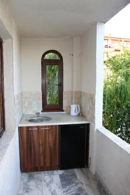 a bathroom with a sink and a window at Villa Elmar in Kiten