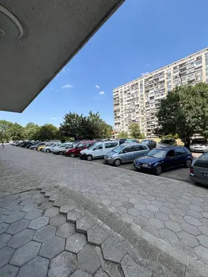 a row of cars parked in a parking lot at Апартамент Боги in Burgas City
