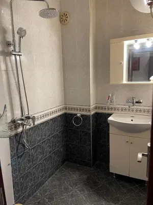 a bathroom with a shower and a sink at Cozy apartment at the heart of Burgas in Burgas City