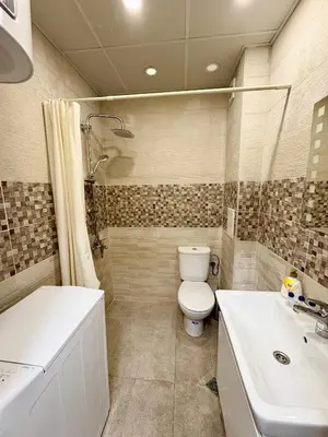 a bathroom with a toilet and a sink at Sweet tiny house-central studio in Varna City