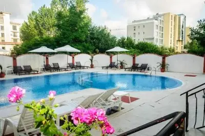 a large swimming pool with chairs and umbrellas at Luxury Studio B02 SB in Sunny Beach