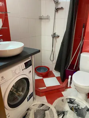 a bathroom with a washing machine and a sink at Luxury Studio B02 SB in Sunny Beach