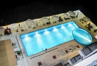 an overhead view of a swimming pool at night at Luxury Studio B02 SB in Sunny Beach