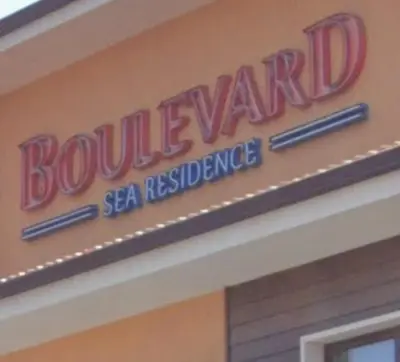 a sign on the side of a building at Boulevard Sea Residenz 250 meter zum Sandstrand in Sunny Beach