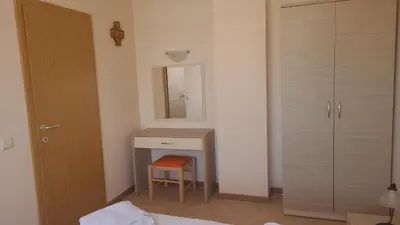 a bedroom with a desk with a mirror and a chair at 1BD Apartment in Royal Sun Complex, Sunny Beach by Flat Mаnager in Sunny Beach