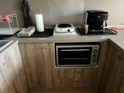 a kitchen with a microwave on a counter at Central 1BR Apartment Near Cathedral in Varna City