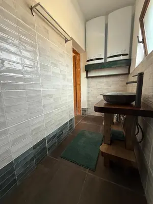 a bathroom with a sink and a table and a counter at Villa Filistrina in Yasna Polyana