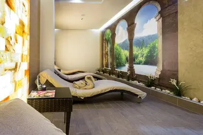 a bedroom with a painting of a bridge and a bed at 2-Bedroom Apartment in Villa Florence Boutique ApartHotel in Sveti Vlas