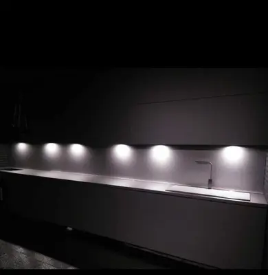 a row of lights on a counter with a sink at Seafront Luxury Studio with Panoramic Sea View, Sunny Beach in Sunny Beach