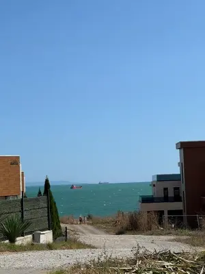 a view of the ocean with a boat in the water at Apartment Victoria in Kraymorie