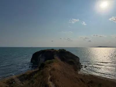 a rock in the middle of the ocean at Apartment Victoria in Kraymorie