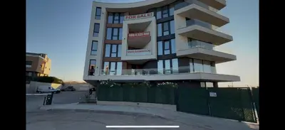 a tall building with a fence in front of it at Apartment Victoria in Kraymorie