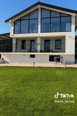 a large building with a green lawn in front of it at Sea Sky House in Varna City