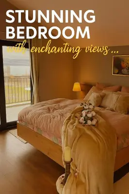 a bedroom with a bed with a window and a bed with flowers on it at Sea Sky House in Varna City